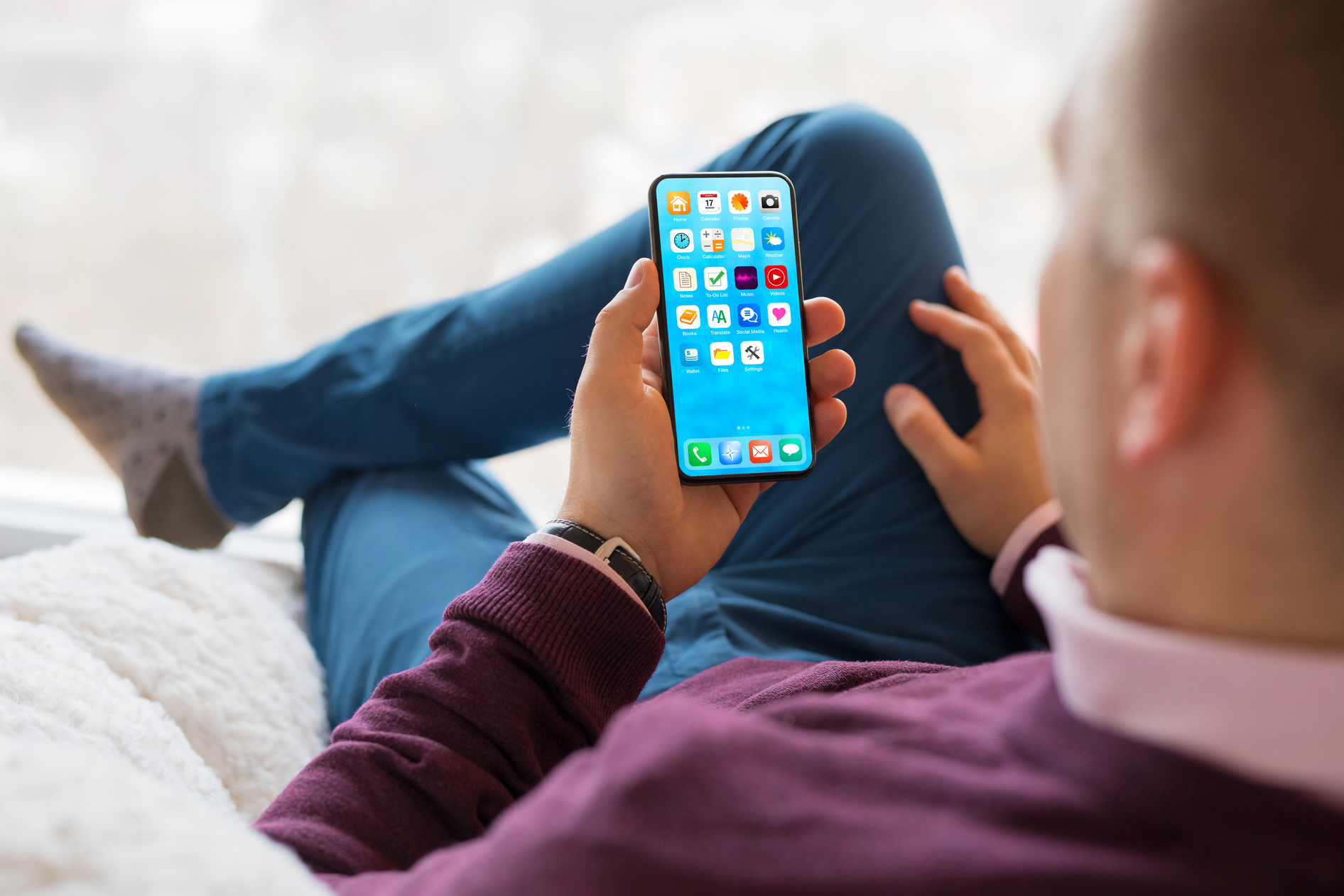 Man Using Mobile Phone at Home
